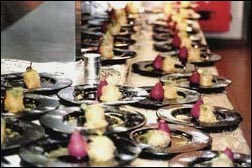 Dishes with food waiting to be served at a wedding reception in London