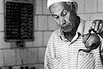 Old man making mint tea in algeria