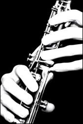 A flute being played by long fingers